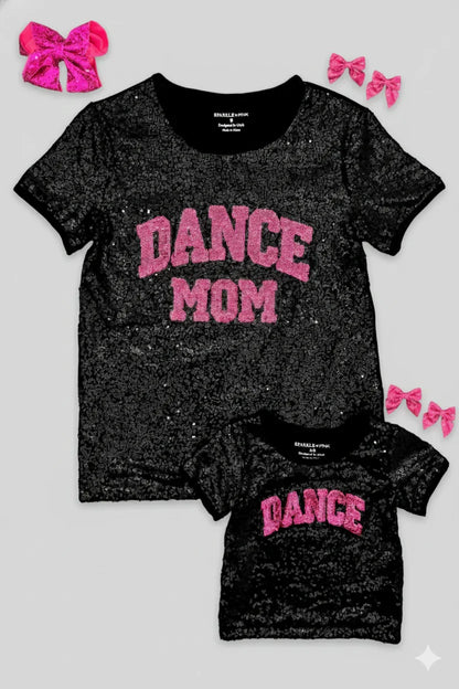 Black glittery t-shirt with 'DANCE MOM' and matching smaller t-shirt with 'DANCE' on a light gray background.